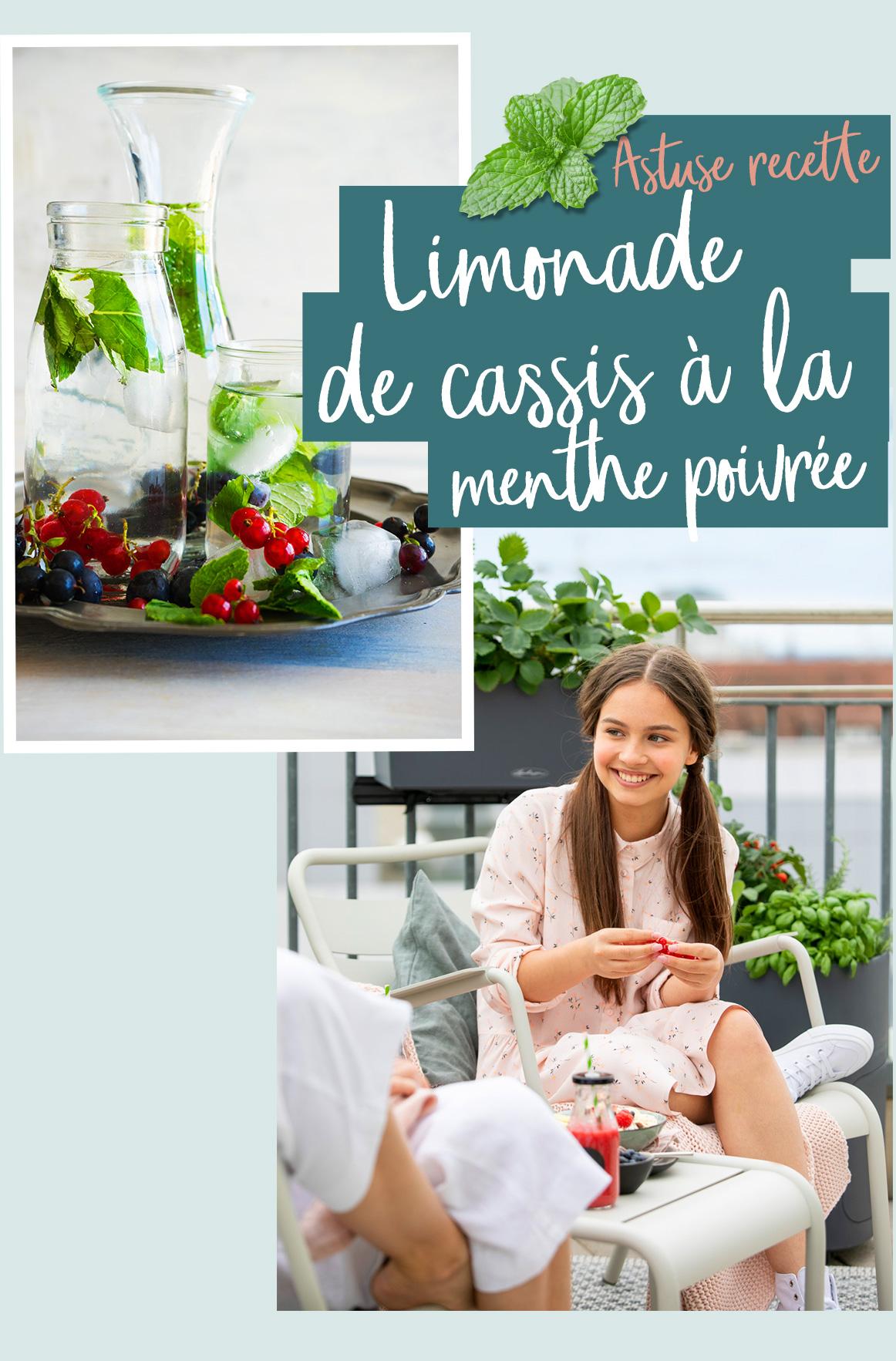 Une fille boit une délicieuse limonade faite maison